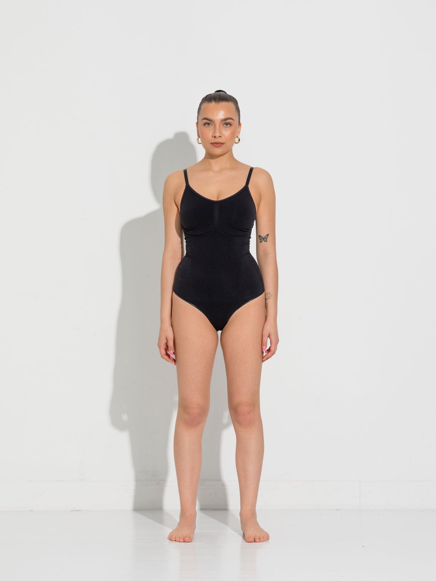Black shapewear bodystocking with high comfort and functionality.